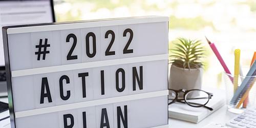 '2022 action plan' sign on desk'2022 action plan' sign on desk'2022 action plan' sign on desk
